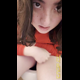 Emi sits on the toilet in a red top with one knee up, rubbing herself as she lets out diarrhea into the bowl, then leans in close to the camera at the end. Vertical format video. Over 5 minutes.